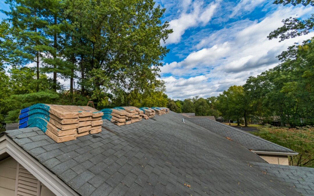 Shingle Bundles Stacked on Roof to Repair Storm Weather Damage